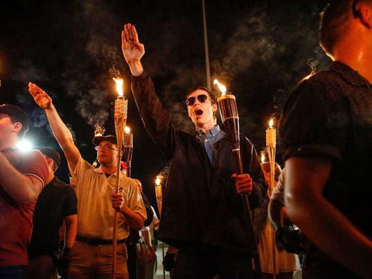 Georgia police invoke anti-mask law made for KKK to arrest racism protesters
	