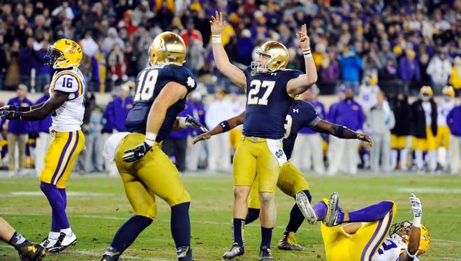 Notre Dame Fighting Irish kicker Kyle Brindza (27) celebrates after kicking the game winning field goal during the second half against the LSU Tigers in the Music City Bowl at LP Field. Notre Dame won 31-28.