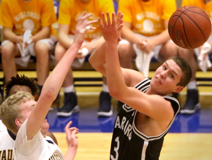 Cedarburg's John Diener has a shot swatted away by