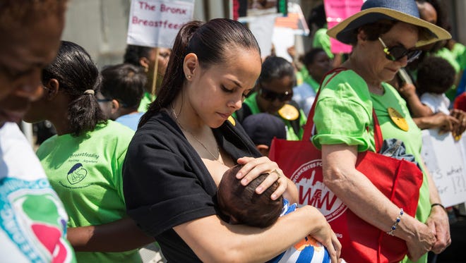 Crystal Mauras breastfeeds her 2-month-old son, Christopher Rhodes Jr, outside City Hall during a rally to support breastfeeding in public on Aug. 8, 2014, in New York City.