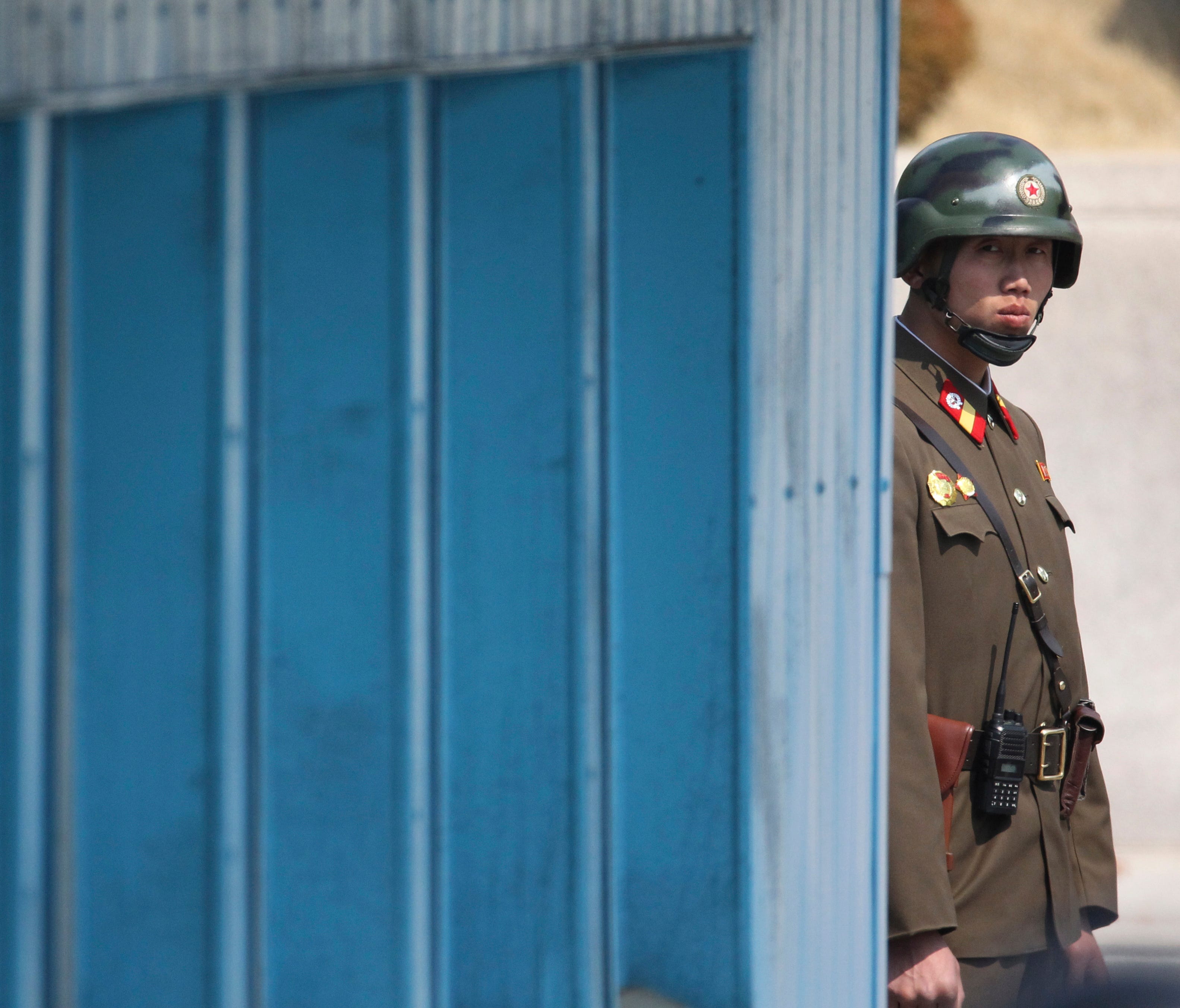 A North Korean soldier looks at the south side while Secretary of State Rex Tillerson is visiting the border village of Panmunjom, which has separated the two Koreas since the Korean War, South Korea, Friday, March 17, 2017.