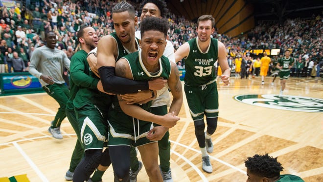 CSU guard Prentiss Nixon is tackled by his teammates following his game-winning shot against Wyoming in Fort Collins, Colorado on Tuesday, February 28, 2017. 