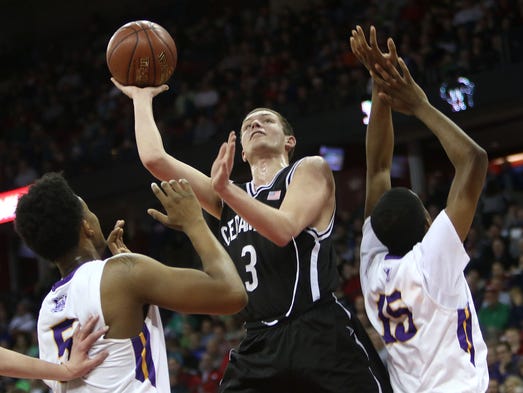 Cedarburg's John Diener shoots between Milwaukee Washington's
