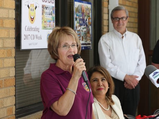 El Paso Community Development Steering Committee Chair Debbie Torres, left, spoke during a ribbon cutting ceremony at the Sara McKnight Transitional Living Center Monday. The center was celebrating  a new roof which was funded through a City Development Block Grant. YWCA CEO Sylvia Acosta is next to Torres and City District 2 Rep. Jim Tolbert is at right. 