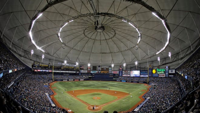 FILE - In this June 17, 2016, file photo, the crowd on Pride Night at Tropicana Field watches during the fifth inning of a baseball game between the Tampa Bay Rays and the San Francisco Giants in St. Petersburg, Fla. Baseball Commissioner Rob Manfred is willing to wait - to a point - for the Rays and Oakland Athletics to get new ballparks. Tampa Bay and Oakland are the only two major league teams currently seeking new stadiums. (AP Photo/Chris O'Meara, File) ORG XMIT: NYHK206