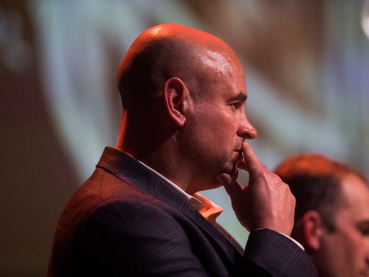 Head coach Jeremy Pruitt listens during University