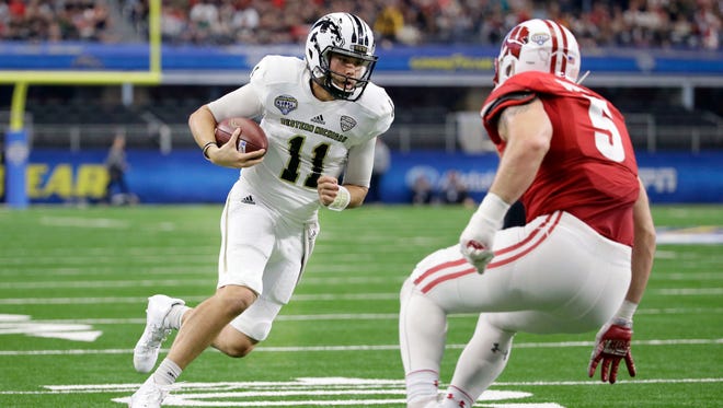 Western Michigan quarterback Zach Terrell (11) runs against Wisconsin defender Garret Dooley (3) during the second quarter of the Cotton Bowl NCAA college football game Monday, Jan. 2, 2017, in Arlington, Texas. Terrell scored a touchdown on the play.