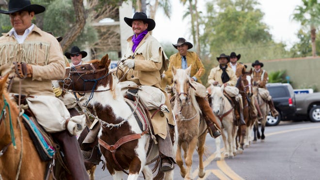 Pony Express riders deliver the mailbag at the Marshall Way Bridge in Scottsdale in January 2015.