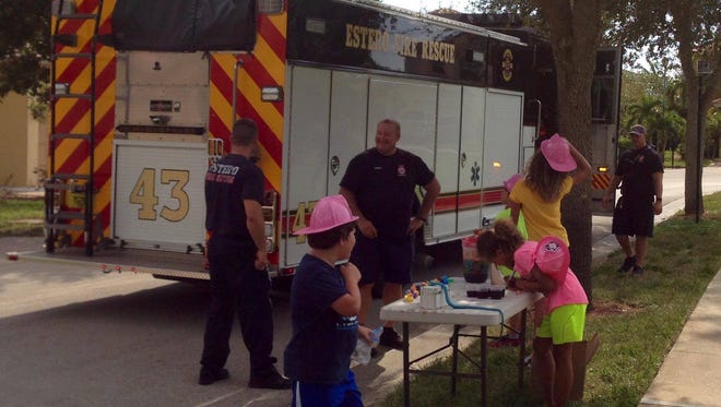 A group of Estero firefighters stopped by a Kool-Aid stand Monday, donating $5 to the children.
