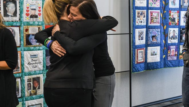 Missy Masse (left) embraces Carla Bautista at the NJ Sharing Network headquarters in New Providence.