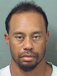 Tiger Woods had to be woken up by an officer after