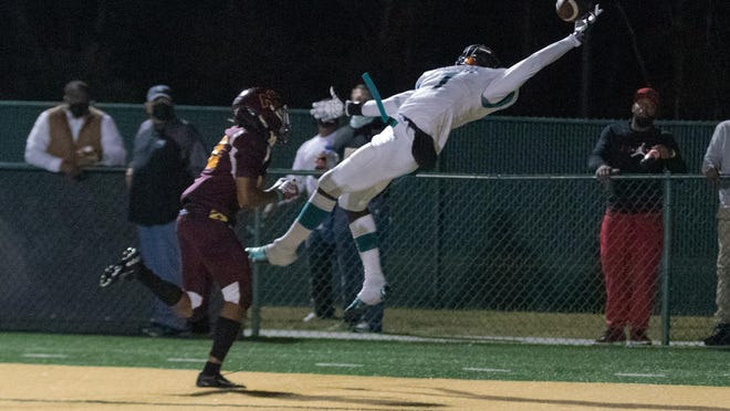 Islands High School's John Dickerson IV makes a one-handed catch for a 12-yard touchdown against New Hampstead on Friday night at Pooler Stadium.