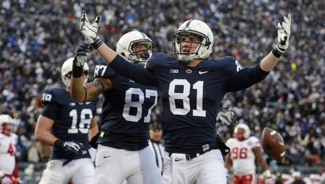 Adam Breneman (81) said perseverance learned at Penn State led him to success at the University of Massachusetts. "I hope I remembered as somebody who always shined a light in the locker room, was always positive," he said of his time with the Nittany Lions. Breneman announced his retirement from football Tuesday.