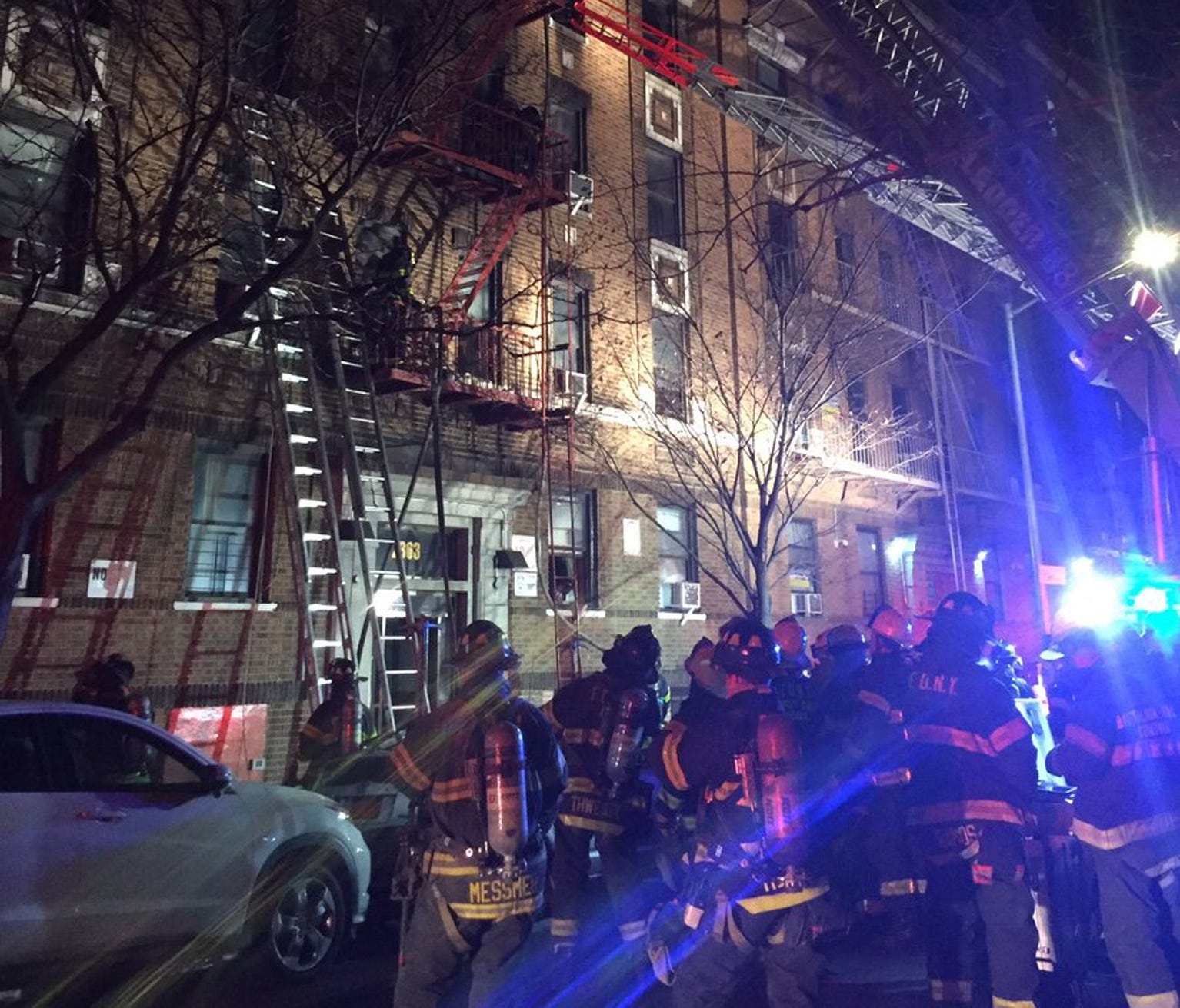 A handout photo made available by the Fire Department of the City of New York shows firefighters operating at the scene of a four-alarm fire at an apartment building in the Bronx borough of New York, on Dec. 28, 2017.