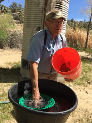 Joe Falcone demonstrates how to pan for gold at Rattlesnake