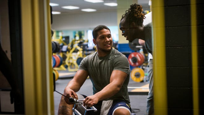 The doctor and coach closest to Pittsburgh's James Conner marvel at the workouts he is undertaking less than two months after his final chemotherapy treatment. Here, Conner talks with teammate and linebacker Anthony Lee McKee.