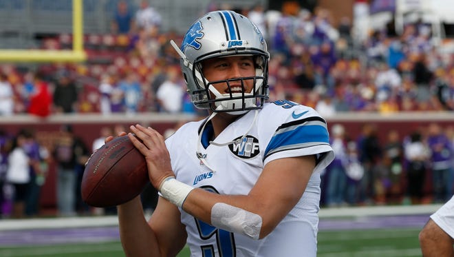Detroit Lions quarterback Matthew Stafford warms up before a game against the Minnesota Vikings in Minneapolis on Sept. 20, 2015.