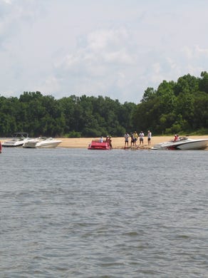 Boaters take a break at a sandbar along the Apalachicola River near Blountstown.