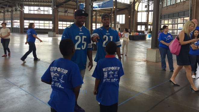 Lions running backs Theo Riddick, left, and Ameer Abdullah talk about healthy eating with kids Tuesday, Sept. 13, 2016.