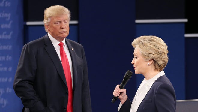 Republican Donald Trump (L) and Democrat Hillary Clinton (R) during the second Presidential Debate at Washington University in St. Louis, Missouri on Sunday, Oct. 9.
