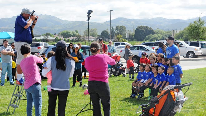 A Salinas Valley Youth Soccer League team has a group photo taken on Saturday morning at the Constitution Soccer Complex.