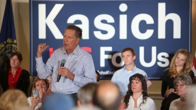 John Kasich speaks to a crowd at a town hall style meeting at the Portsmouth Country Club while campaigning in New Hampshire on Wednesday, July 22.