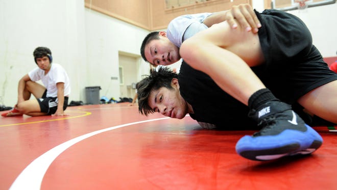 Oxnard High senior Jeremy Trinh (top) will attempt to medal for the fourth straight year at Saturday's 35th annual Newbury Park Invitational.