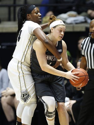Iowa will look to slow down high-scoring guard Rachel Banham and the Minnesota Golden Gophers, right, on Monday.
