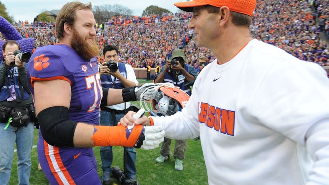 Clemson Coach Dabo Swinney greets guard Eric Mac Lain on the Tigers' Senior Day Saturday against Wake Forest.
