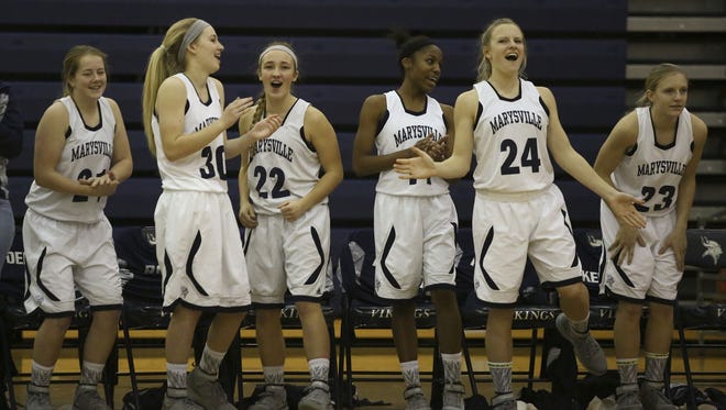 Marysville players cheer as they widen their lead over Marine City during a basketball game Friday, Jan. 8, 2016 at Marysville High School.