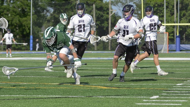 (SPORTS) 05/31/17 Rumson-Fair Haven's Colin Pavluk (21) and Bryan Hess (31) chase down a Ramapo defender during the NJSIAA Group II State Final on Wednesday, May 31 at Shore Regional High School. Ultimately, Rumson-Fair Haven  suffered a 12-11 overtime loss to Ramapo  Wednesday.