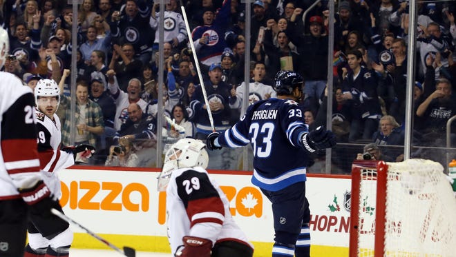 Nov 21, 2015: Winnipeg Jets  defenceman  Dustin Byfuglien (33) celebrates his goal after he scores on Arizona Coyotes goalie Anders Lindback (29) during the second period at MTS Centre.