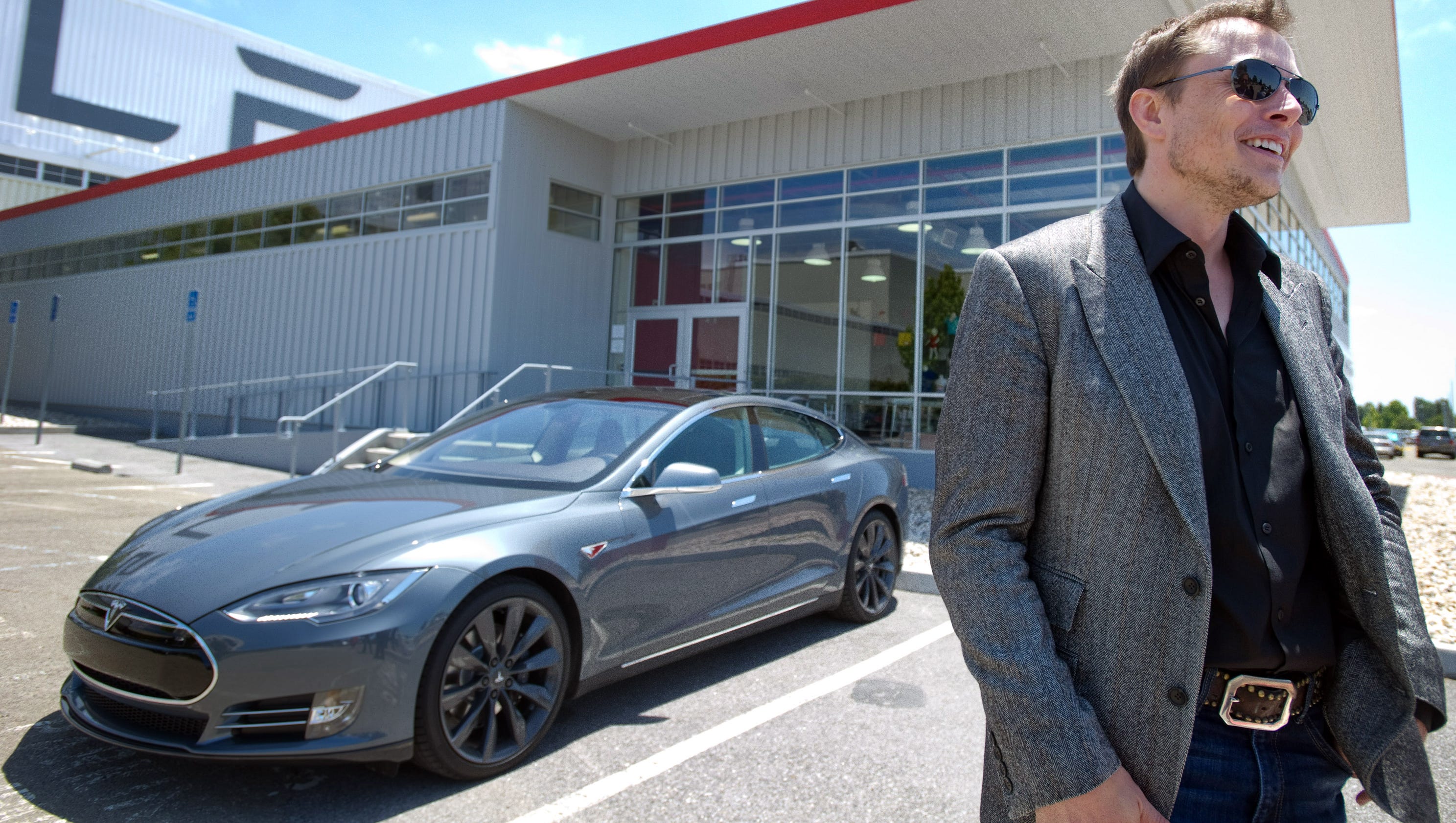 Elon Musk defends Tesla electric car after fire