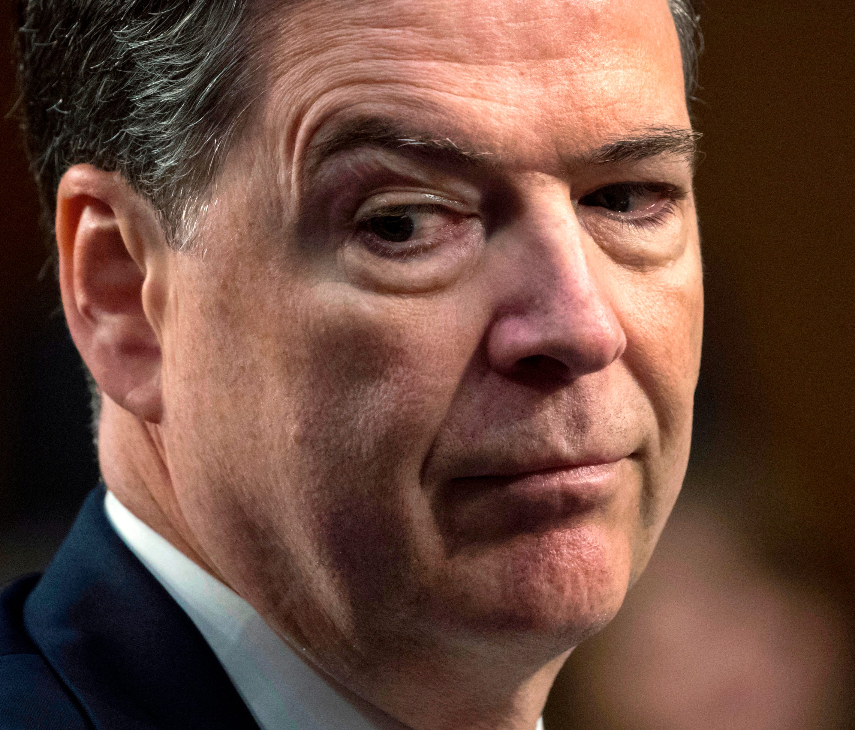 Former FBI director James Comey testifies before the Senate Select Committee on Intelligence, on Capitol Hill.