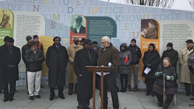 On Jan. 15, 2019, the Rev. Jefferey P. Kee, foreground left, senior pastor at New Faith Baptist Church of Christ on the East Side, speaks to the Rev. Tim Ahrens, of First Congregational UCC Downtown, about discrimination in the Columbus Division of Police. The event was at the Washington Gladden Social Justice Park.