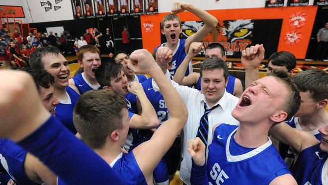 Southeastern celebrates after defeating Lynchburg-Clay 65-62 Friday in Waverly.