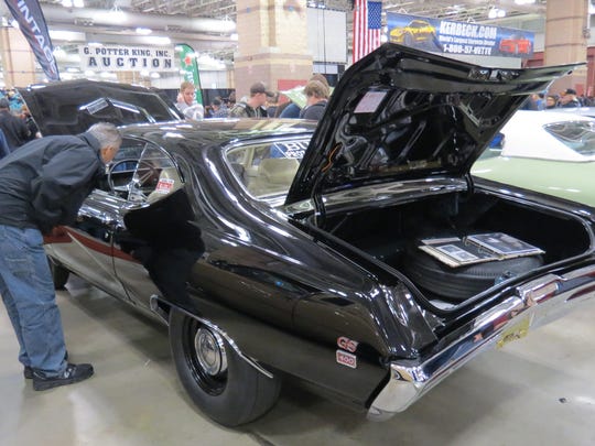 Art Collins, of Mantua, NJ, looks over the interior of a Buick GS 400.