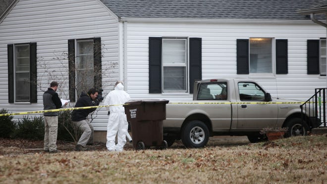 Police and FBI agents investigate the scene where Craig Michael Wood was arrested at 1538 E. Stanford St. on Wednesday, February 19, 2014.