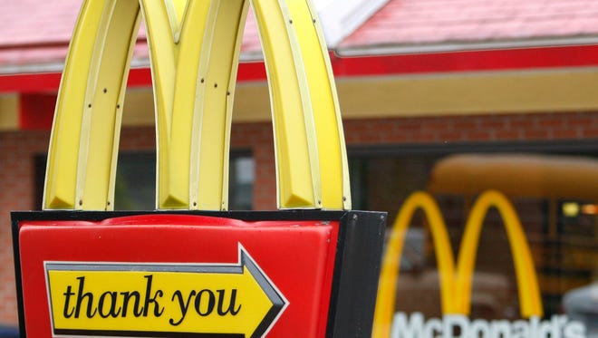 This 2009 file shows the red and yellow signs with the trademark golden arches of a McDonald's in Pittsburgh.