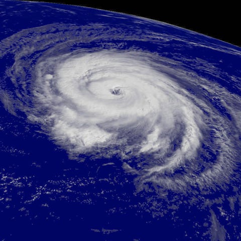 A satellite image shows Hurricane Helene spinning 
