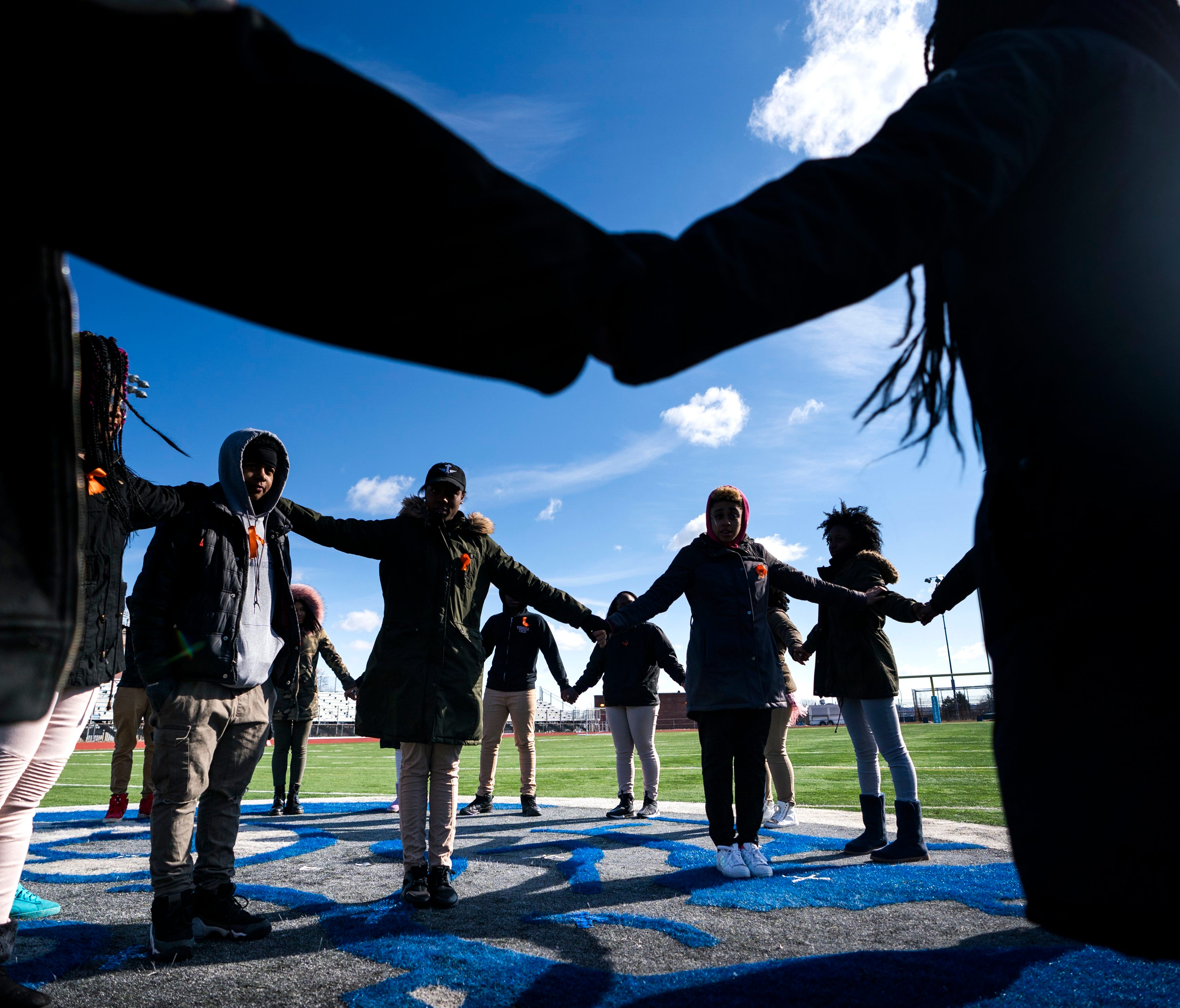 Eastern High School students walk out of class and assemble on their football field for the National School Walkout, a nation-wide protest against gun violence, in Washington, DC.