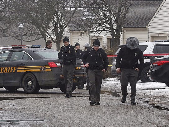 Police investigate the scene of a shooting in Westerville,