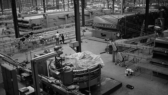 Workers are in the final stages of construction at the Joseph Schlitz Brewing Co. plant at 5151 Raines Road in mid-April 1971.  Work at the 40-acre site will end and beer making will begin soon, according to plant manager John Stevens.  Each bottle production line will fill, label and cap 850 bottles per minute when the plant is completed.