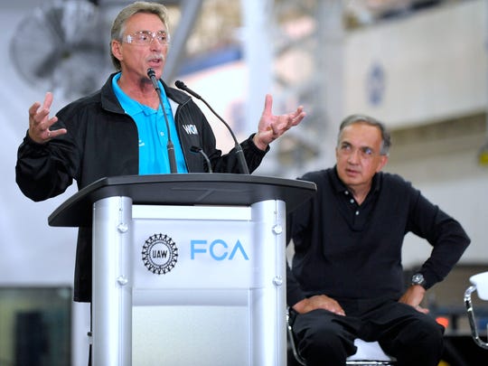 Norwood Jewell, former UAW vice president of the FCA US Department, speaks at the Sterling Stamping Plant in 2016 as FCA CEO Sergio Marchionne listens.