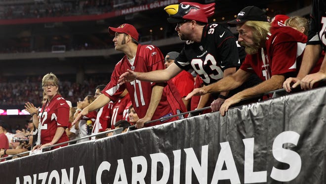 Arizona Cardinals fans cheer during the 2015 game against the St. Louis Rams at University of Phoenix Stadium.