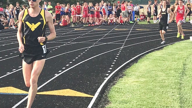 Colonel Crawford's Chad Johnson breezes to a win in his prelim heat of the 1600 after anchoring the 4x800 to a district title.