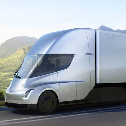 The Tesla Semi drives on a country highway.