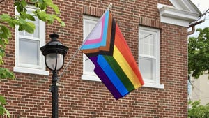 A Progress Pride Flag flies outside Novus ACS in Courthouse Square in Stroudsburg.