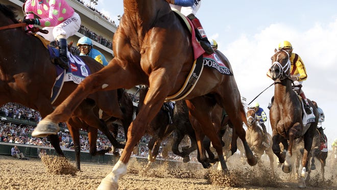 Horses make their first pass by the grandstands for The Kentucky Derby.
May 2, 105