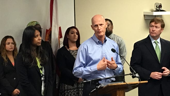 Florida Gov. Rick Scott speaks at a news conference, Friday, July 29, 2016, in Orlando, Fla., where he announced that the state likely has the first cases of Zika transmitted by mosquitoes on the U.S. mainland. (Naseem Miller/Orlando Sentinel via AP)